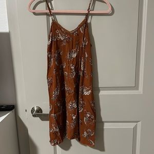 Boutique dress. Burnt orange floral print. Size small. Loose fit.